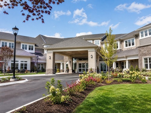A resident room in a senior living community with personalized furniture and decor